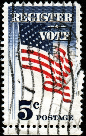 USA - CIRCA 1964  A stamp printed in United States of America shows waving US stars flag with the inscription  Register Vote , circa 1964 のeditorial素材