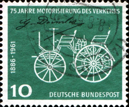GERMANY - CIRCA 1961  A stamp printed in German Federal Republic honoring 75th Anniv of Daimler-Benz Patent, shows Early Daimler Motor Car, circa 1961のeditorial素材