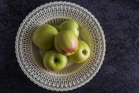 Top view of green apples on a black stone tableの写真素材