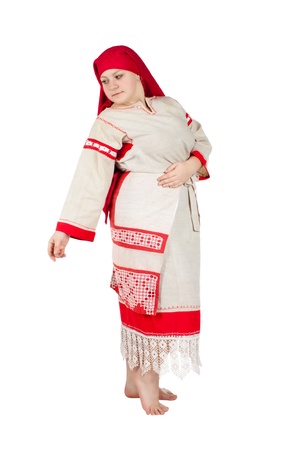 Pretty russian girl clothed in national dress posing over whiteの写真素材
