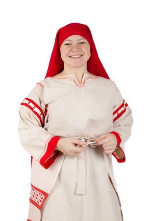 Pretty russian girl clothed in national dress posing over whiteの写真素材