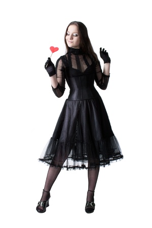 Gothic girl with lollipop isolated over whiteの写真素材
