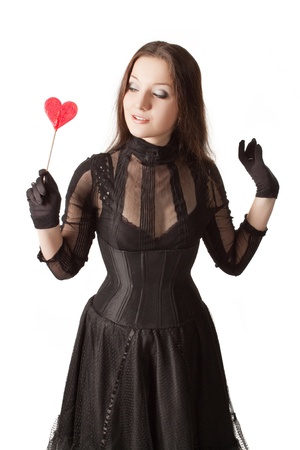 Gothic girl with lollipop. Isolated over white.の写真素材