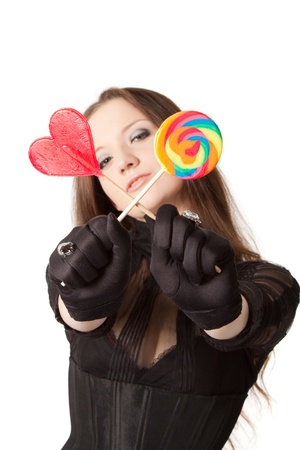 Gothic girl with lollipops. Isolated over white.の写真素材