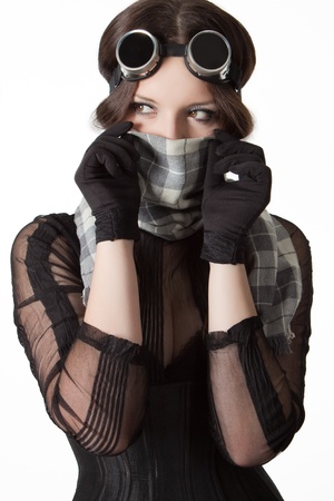 Girl with scarf and googles isolated over whiteの写真素材