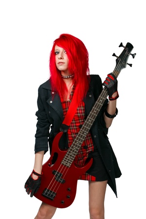 Redhead girl with bass guitar posing over whiteの写真素材