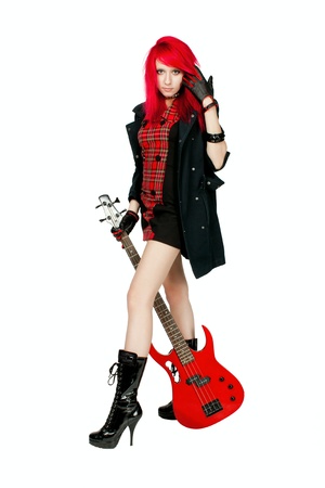Redhead rocker girl posing over white backgroundの写真素材