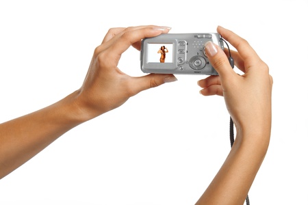 Hands holding camera over white backgroundの写真素材
