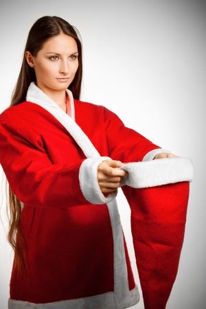 Pretty girl in Santa's dress asking for donationの写真素材
