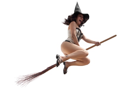 Funny witch flying on broom over white backgroundの写真素材