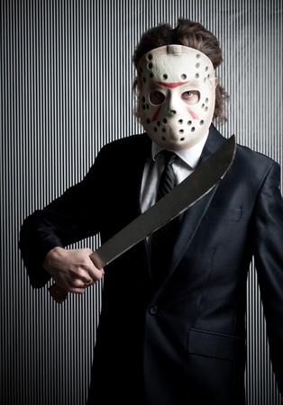 Office maniac in mask posing over lined backgroundの写真素材