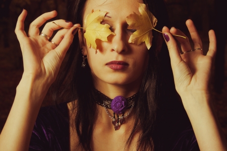 Portrait of pretty gothic girl with leaves の写真素材