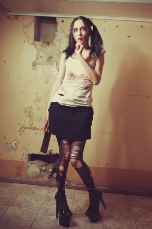 Seductive gothic girl with chopper. Indoors shooting.の写真素材