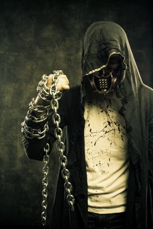 Merciless fighter of cruel post apocalyptic world with chainsの写真素材