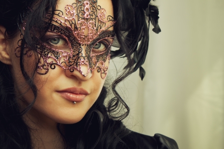 Old-fashioned woman face in mask close-upの写真素材