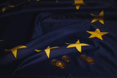 Golden bitcoins laying on  EU flagの写真素材