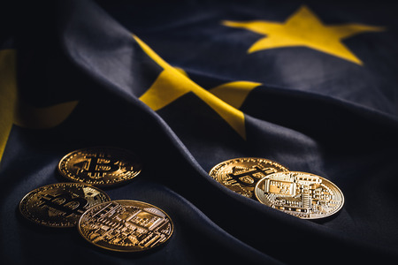 Golden bitcoins laying on  EU flagの写真素材