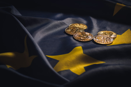 Golden bitcoins laying on  EU flagの写真素材