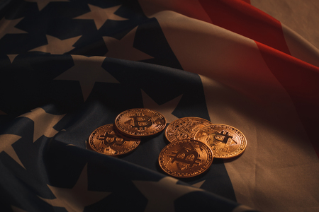 Golden bitcoins laying on USA flagの写真素材