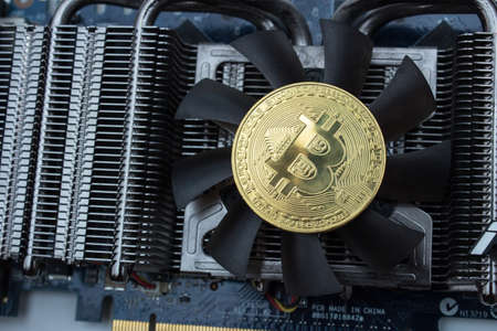 Bitcoin on graphic videocard in soft lights