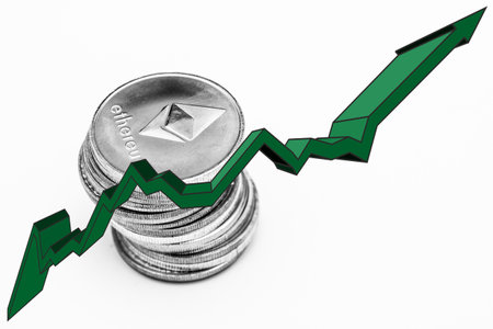 Stack of ethereum coins and green arrow over white backgroundの写真素材