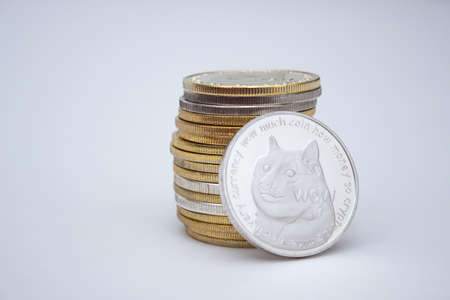 Stack of dogecoins over white background