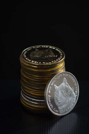 Stack of dogecoins over dsrk background