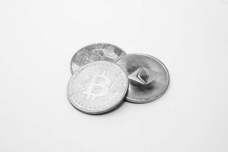 Bitcoin, ethereum coin and ripple coin over white backgroundの写真素材