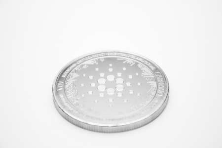 One silver Cardano ADA coin over white background