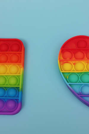 Trendy fidgets over blue backgroundの写真素材