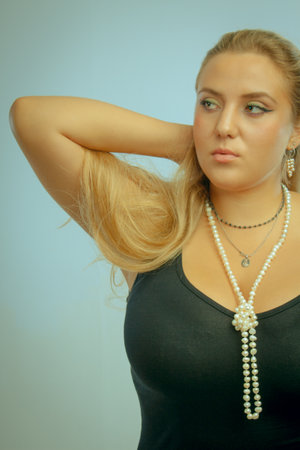 Pretty beautiful glamour lady in black dressの写真素材