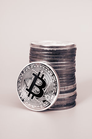 Stack of bitcoins over white backgroundの写真素材