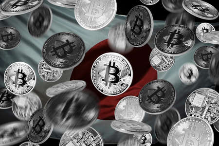 Falling bitcoins over japanese flagの写真素材