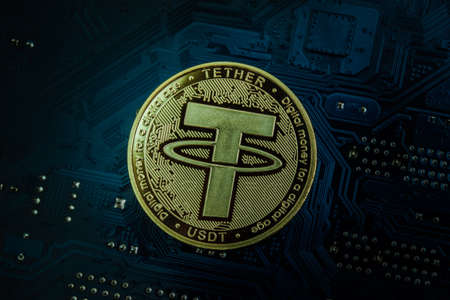 Closeup shot of tether coin over motherboard