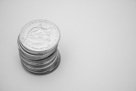 Stack of dogecoins over white background
