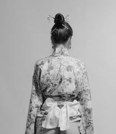 Japanese girl in kimono. Rear view.の写真素材