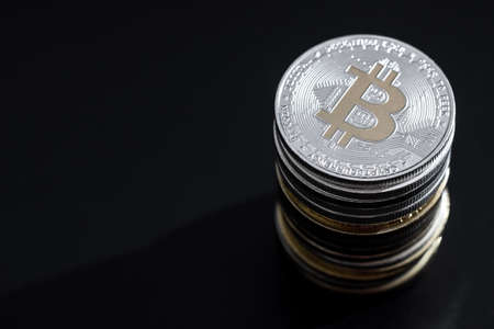 Stack of bitcoins over dark background