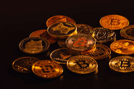 Pile of cryptocurrencies over dark backgroundの写真素材