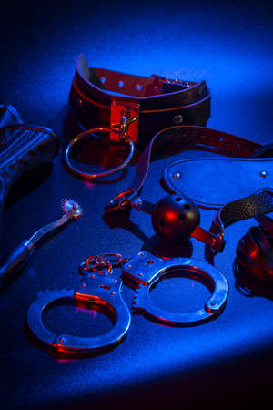 Closeup shot of erotic toys for bdsm over dark backgroundの写真素材