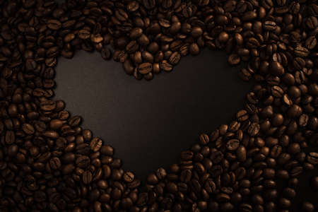 Coffee beans over black background. Coffee beans texture.