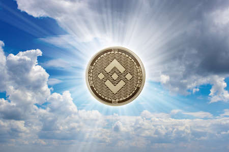 One binance coin over blue skyの写真素材