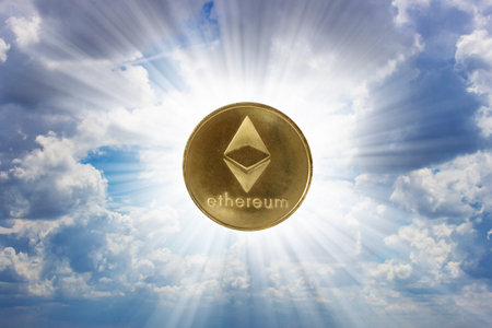 Ethereum coin over blue skyの写真素材