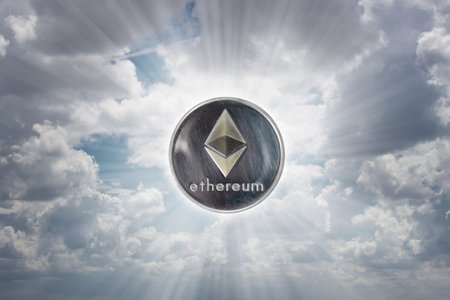 Ethereum coin over blue sky. Cryptocurrency concept.