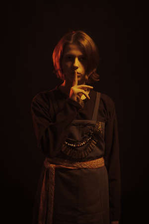 Pretty medieval scandinavian woman posing over dark backgroundの写真素材