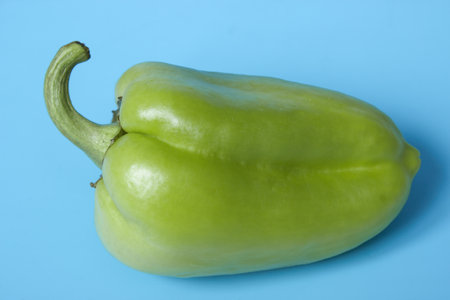 Close-up shot of green pepper over blue backgroundの写真素材