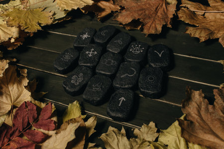 Wicca divination runes over wooden planksの写真素材