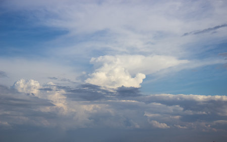 Blue sky with clouds in sun lightの写真素材
