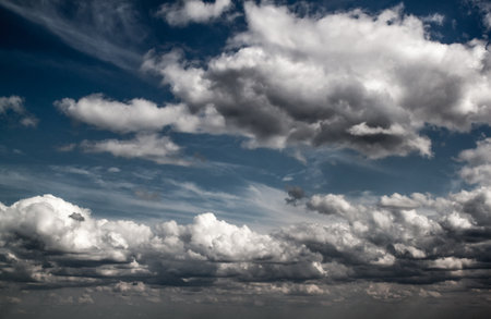 Blue sky with clouds in sun lightの写真素材