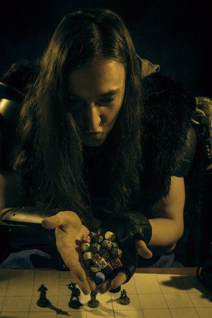 Young adult playing role playing game as a warrior.