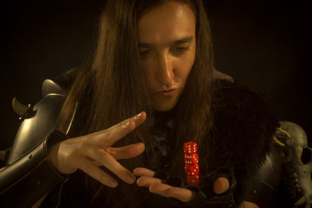 Young man playing role playing game as warrior.の写真素材